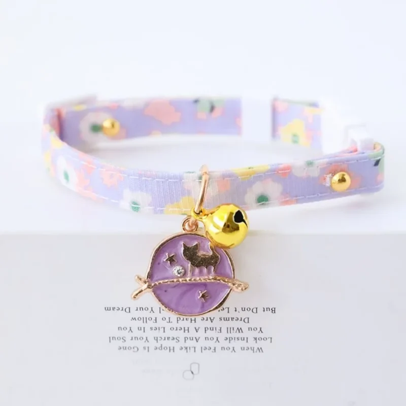purple collar with bell and moom